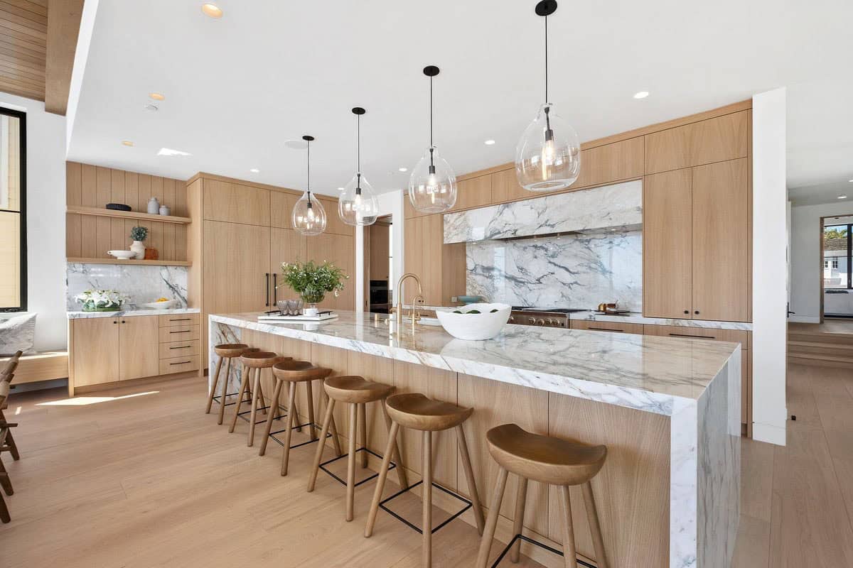 Luxury coastal kitchen remodel with marble island and custom wood cabinetry — Bishop Construction, San Diego